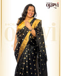 Model wearing the black Chanderi handwoven saree with gold and silver leaf zari motifs by House of Ojasvi.
