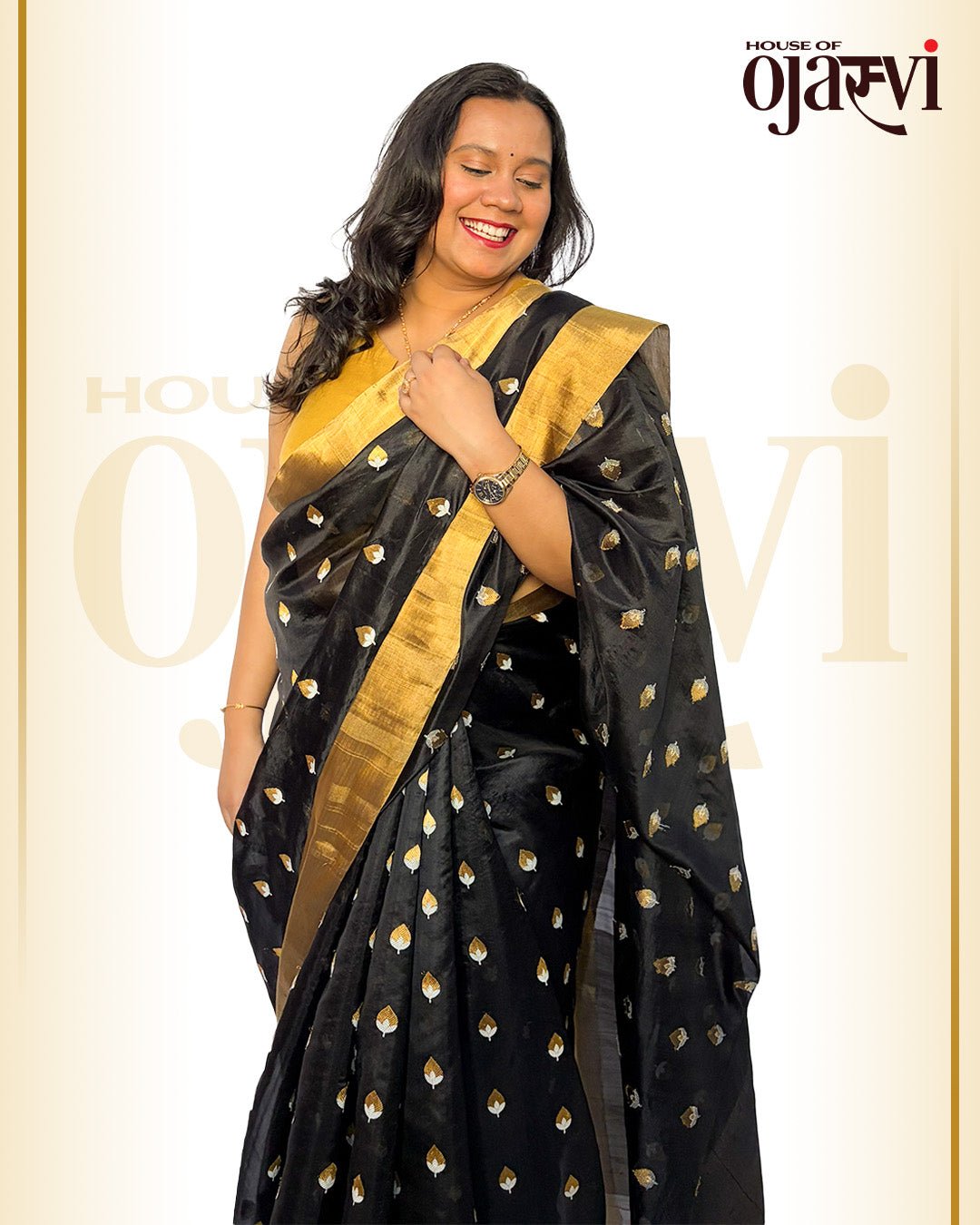 Model wearing the black Chanderi handwoven saree with gold and silver leaf zari motifs by House of Ojasvi.