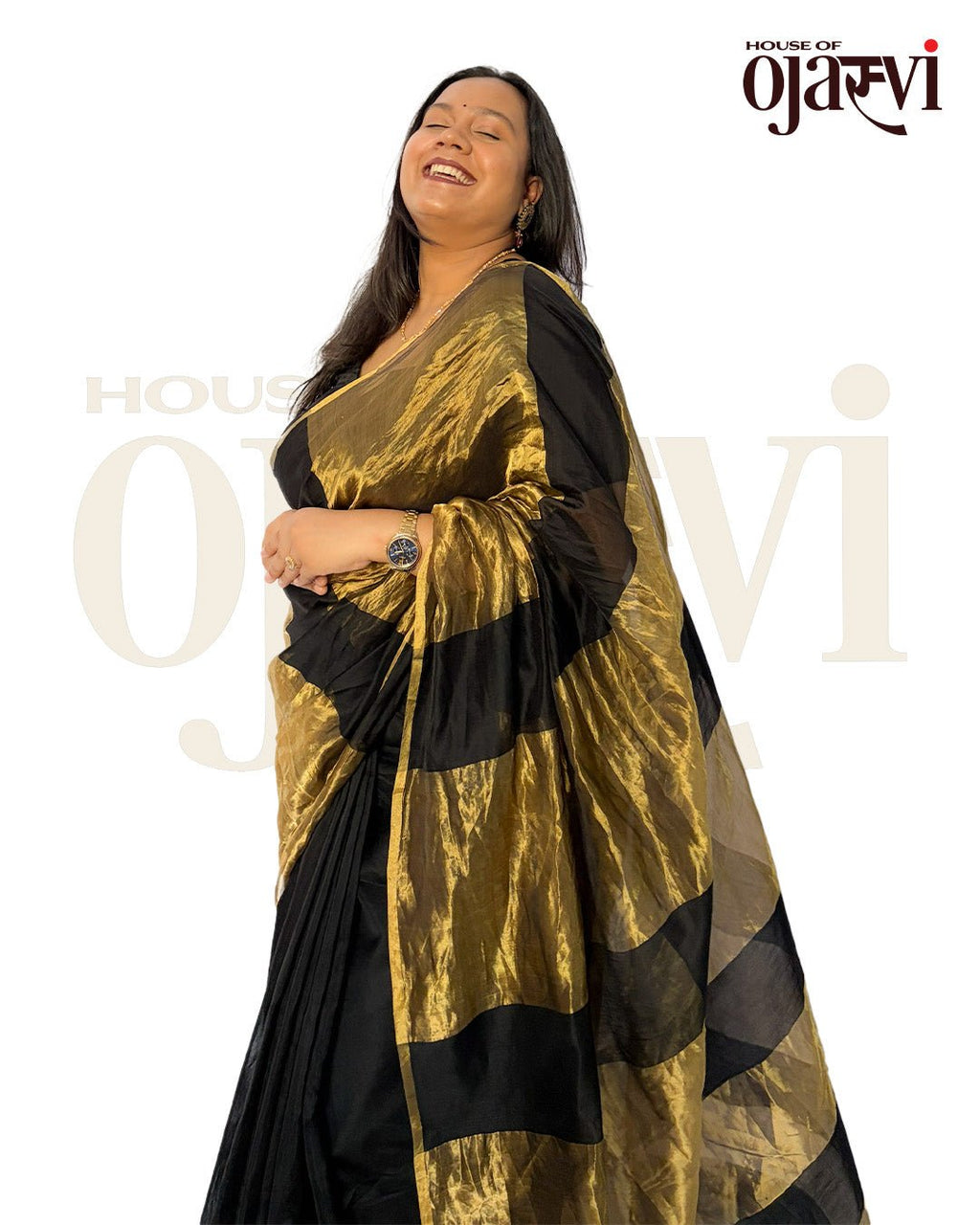 Model posing gracefully in the black Chanderi saree, highlighting the contrast of the rich golden zari panels.