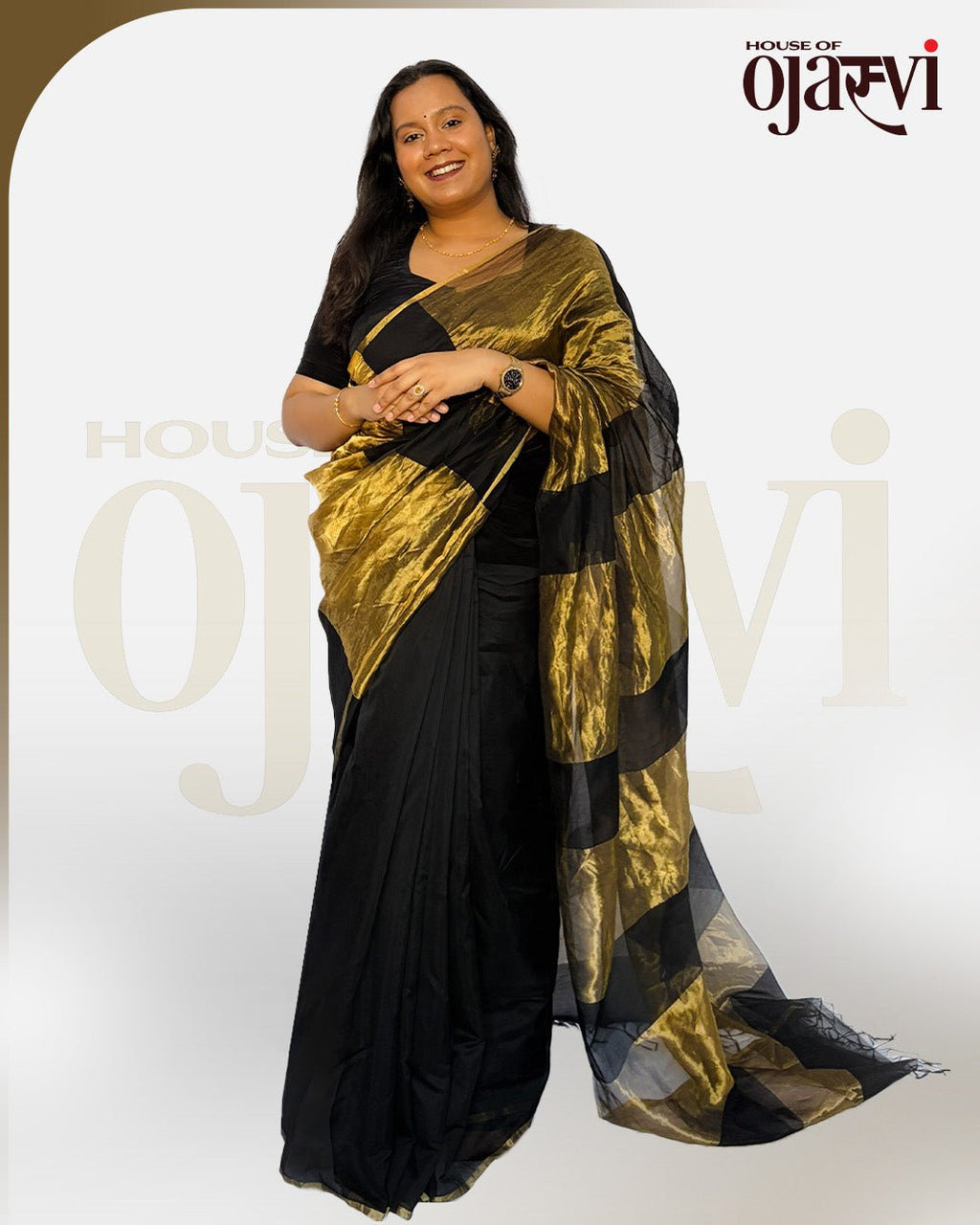 Elegant full-length portrait of the black Chanderi handwoven saree with a majestic golden zari pallu flow.