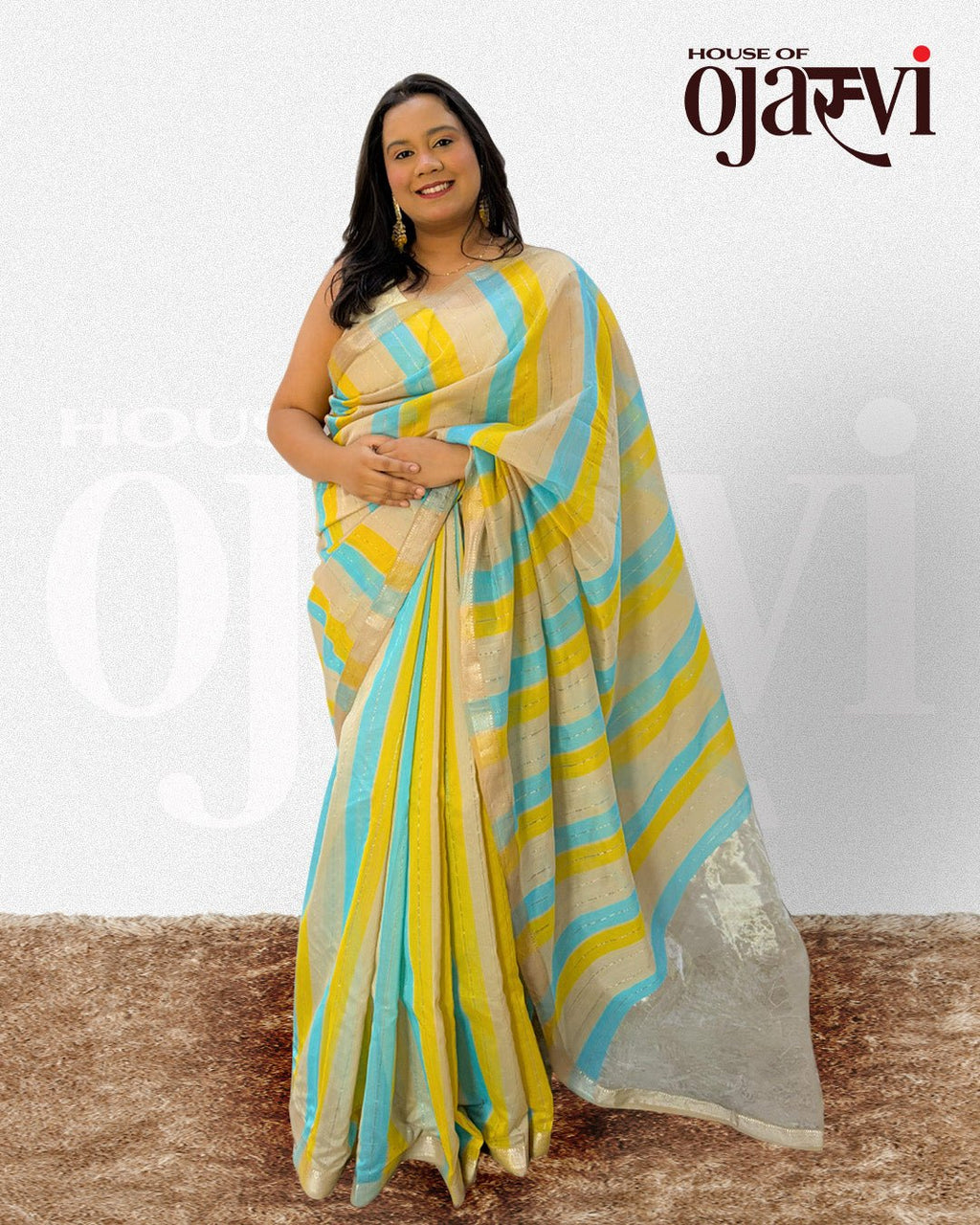 Close-up view of the blue and yellow striped handwoven Maheshwari saree with gold zari details by House of Ojasvi.