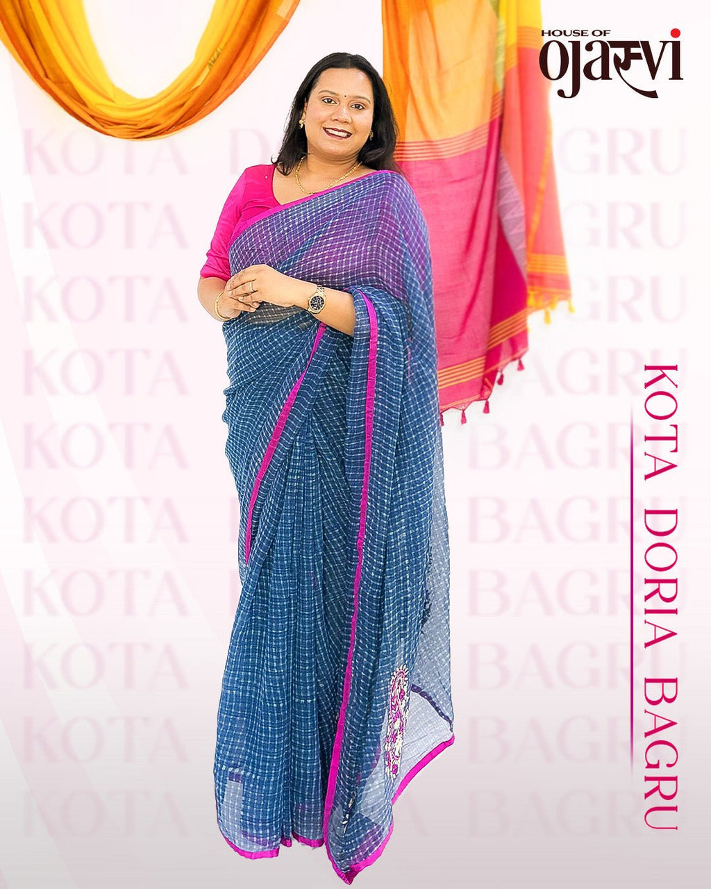 Close-up of blue checked handwoven Kota Doria saree showing pink and white embroidered paisley motifs by House of Ojasvi.