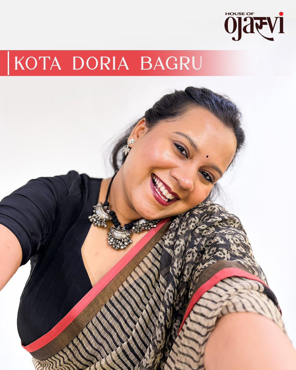 Full drape view of the cream and brown striped Kota Doria saree showcasing traditional Bagru print pallu.
