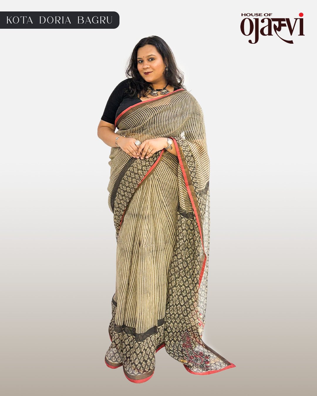 Model styling the cream and brown striped handwoven Kota Doria Bagru saree with ethnic jewelry.