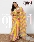Close-up view of a model holding roses while wearing the hot pink and yellow striped Maheshwari handwoven saree by House of Ojasvi.