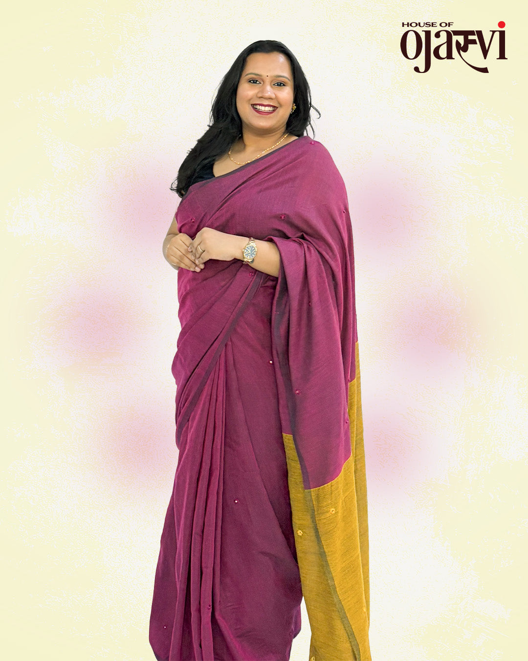 Full-length front view of a woman draped in a magenta and mustard cotton handwoven saree for workwear and festive occasions.