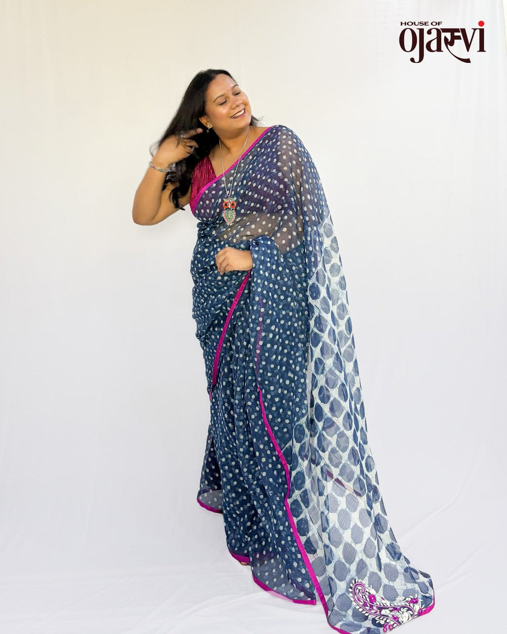 Close-up view of the pallu showing embroidered paisley motifs on the indigo polka dot Kota Doria saree.