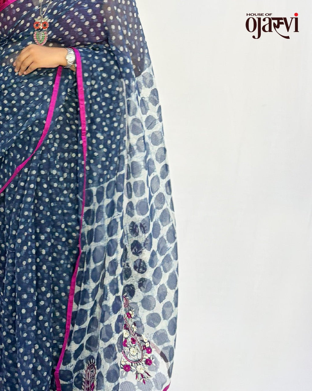 Side profile view highlighting the lightweight texture and drape of the indigo polka dot Kota Doria saree.