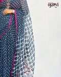 Side profile view highlighting the lightweight texture and drape of the indigo polka dot Kota Doria saree.