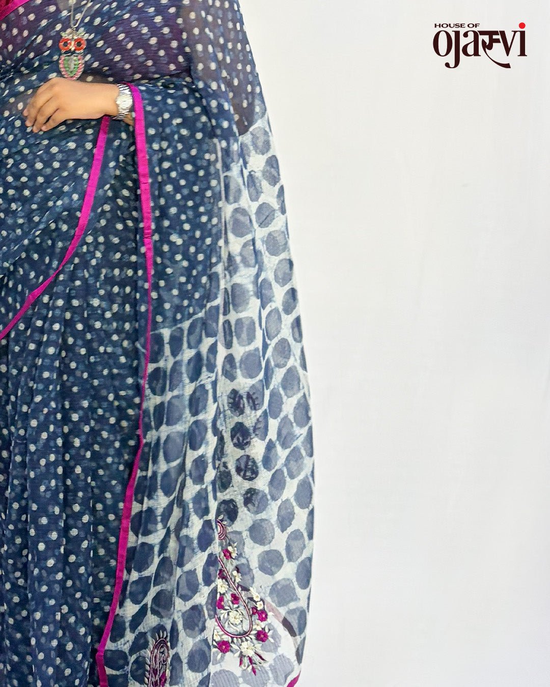 Side profile view highlighting the lightweight texture and drape of the indigo polka dot Kota Doria saree.
