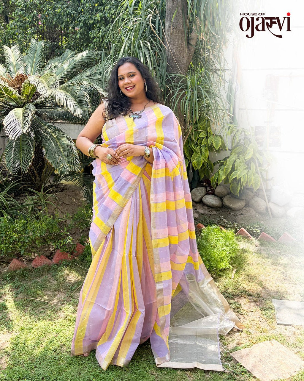 Back view showcasing the fluid drape and soft pastel palette of the Maheshwari handwoven saree.