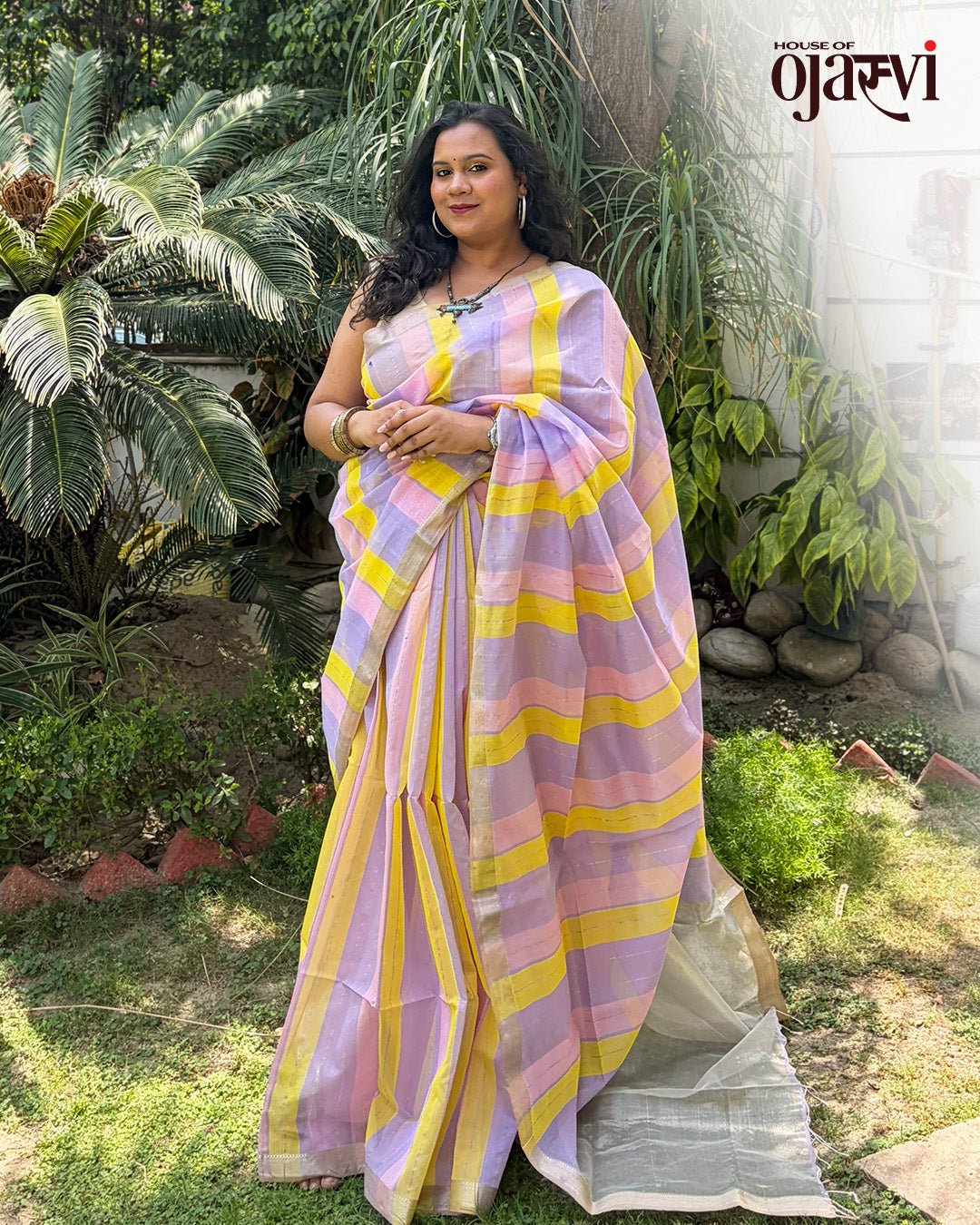 Full drape view of the lavender, yellow, and pastel pink striped Maheshwari handwoven saree.
