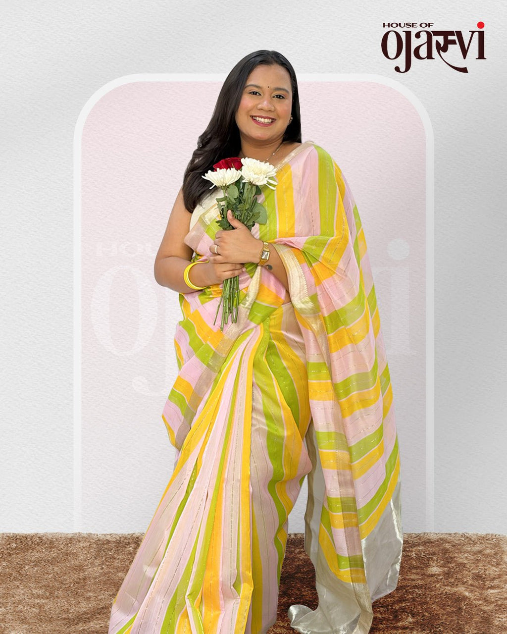 Close-up view of the fluid pleats and delicate gold zari lines on the Maheshwari handwoven saree.