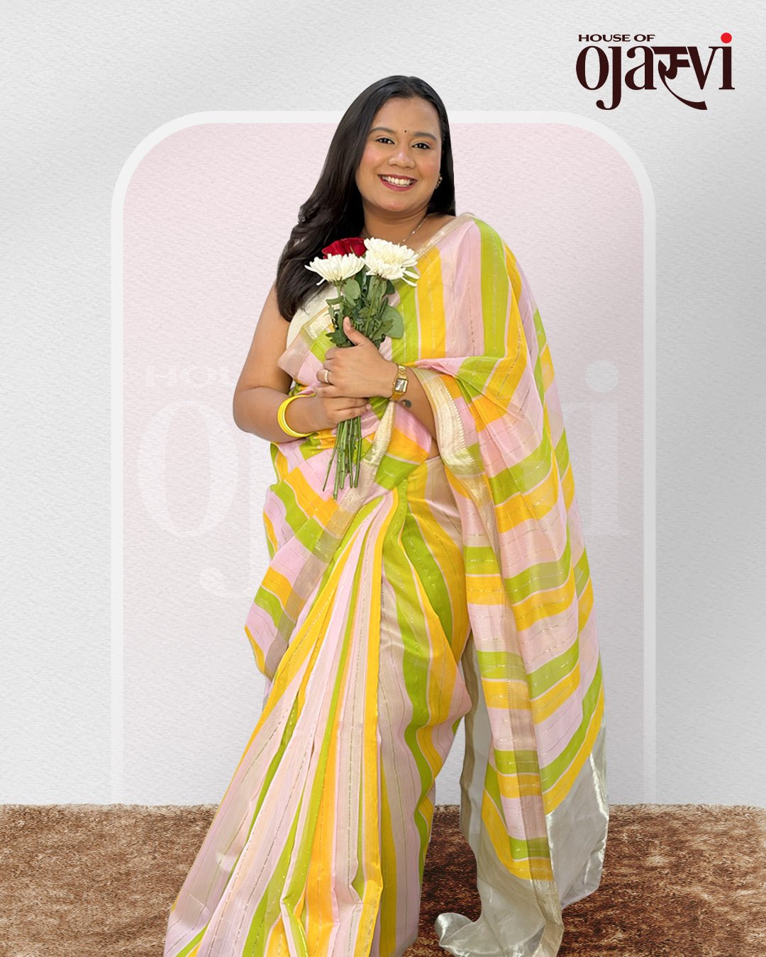 Close-up view of the fluid pleats and delicate gold zari lines on the Maheshwari handwoven saree.