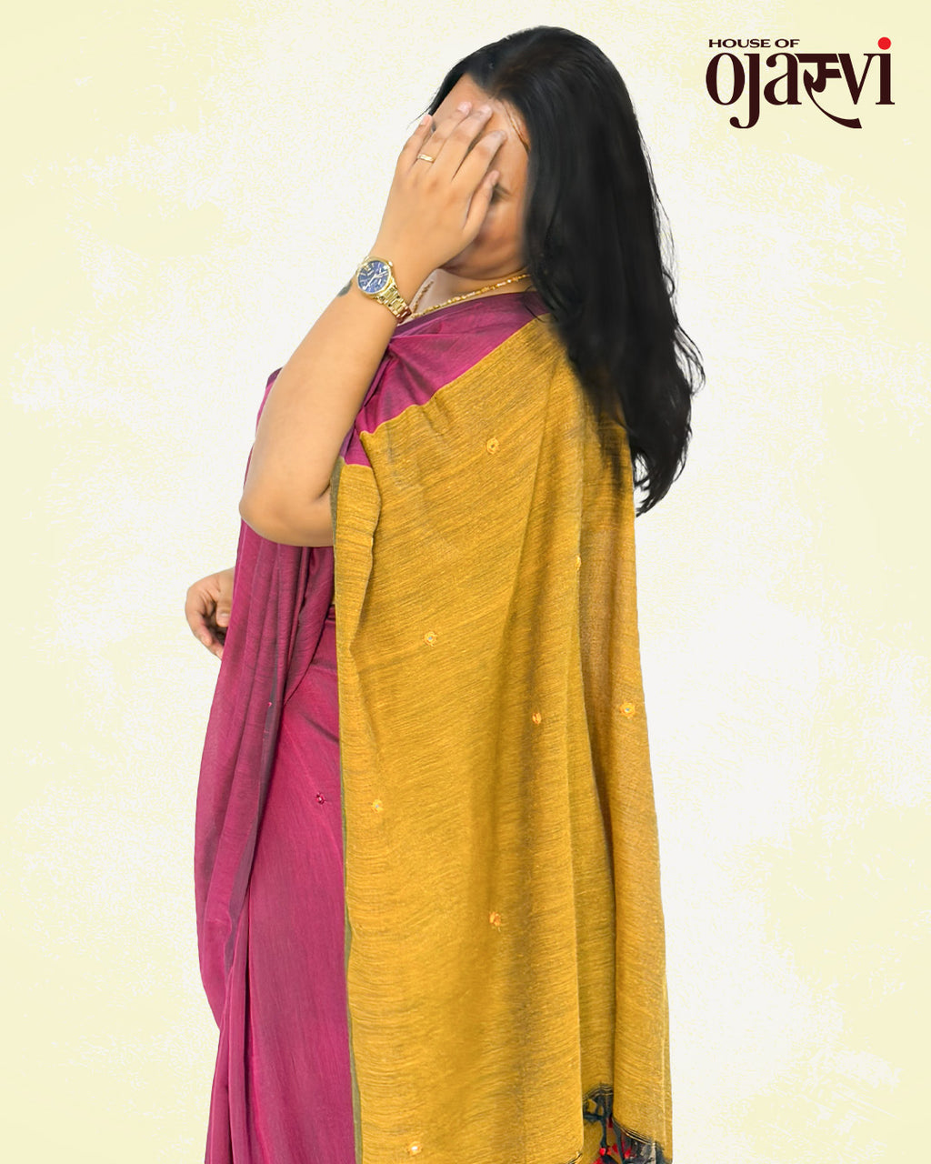 Close-up view of the textured mustard yellow pallu on a magenta cotton handwoven saree from House of Ojasvi.