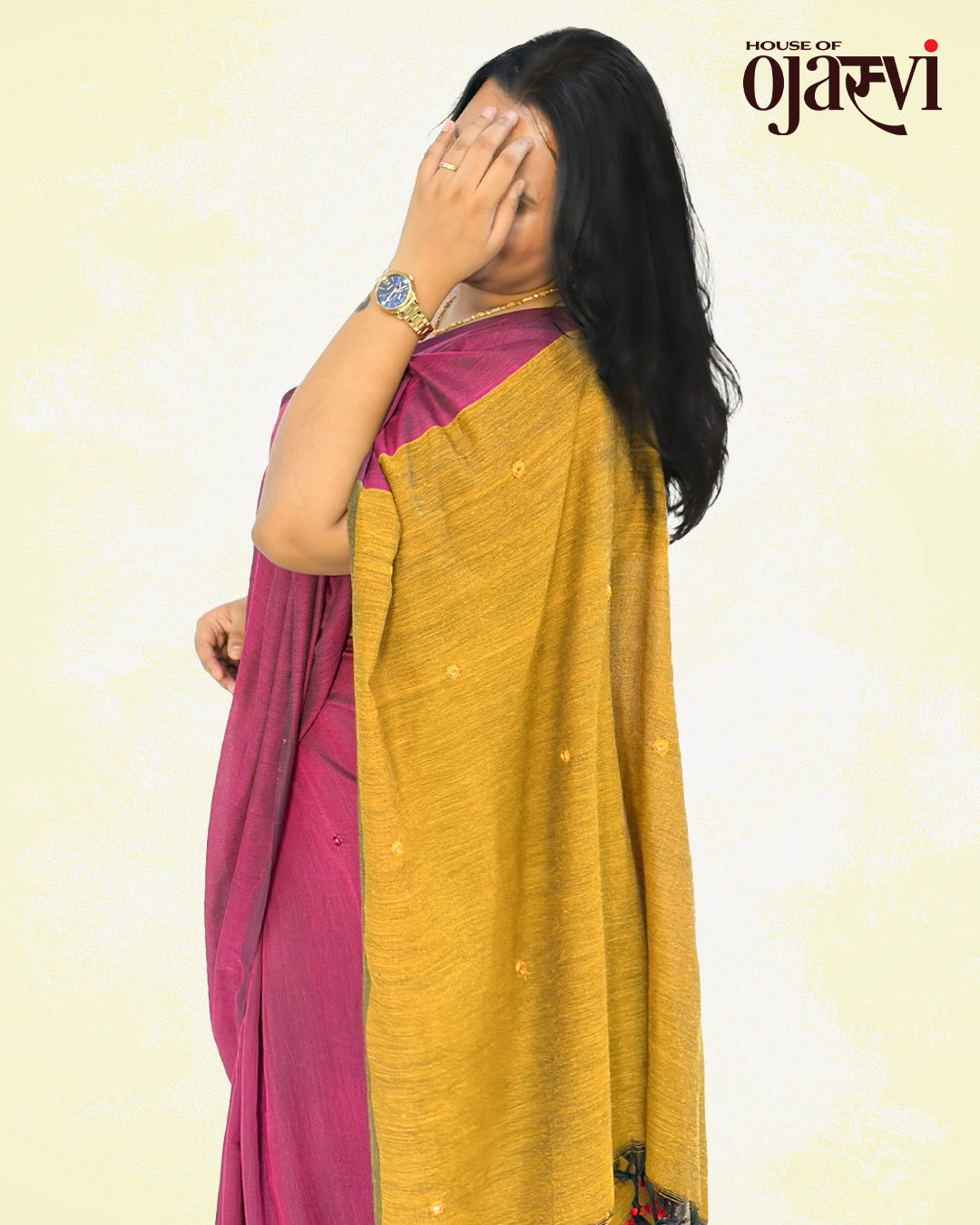 Close-up view of the textured mustard yellow pallu on a magenta cotton handwoven saree from House of Ojasvi.
