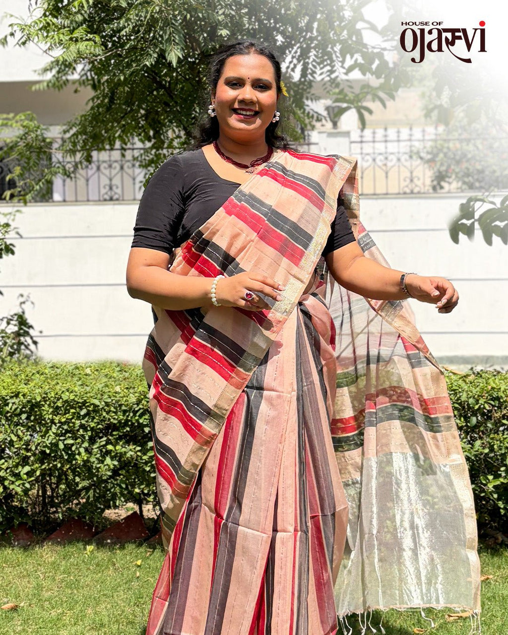 Full drape view of the maroon, black, and peach striped Maheshwari handwoven saree.