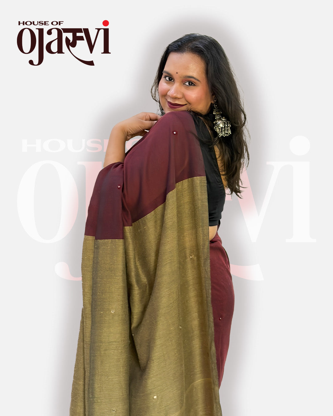 Model wearing the deep maroon handwoven cotton saree with delicate buti accents and a black blouse by House of Ojasvi