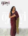 Full-length view of the maroon and olive-gold contrast pallu cotton handwoven saree highlighting the handcrafted red-and-black tassel hem