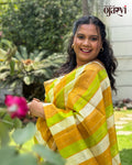 Close-up view of pleats on the orange and green striped handwoven Maheshwari saree by House of Ojasvi
