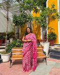 Model wearing the pink and white block-print handwoven Maheshwari saree by House of Ojasvi.