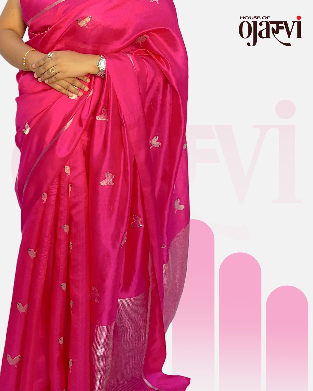 Close-up of the elegant pleats and silver zari border on the vibrant pink Chanderi handwoven saree.