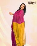 Model wearing a vibrant magenta and mustard yellow handwoven cotton saree showcasing the pallu, by House of Ojasvi.